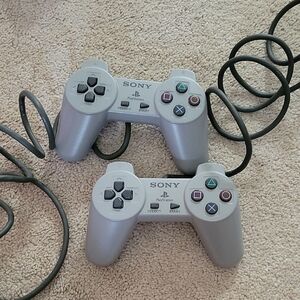 Sony PlayStation Silver Controllers